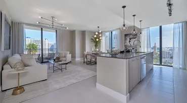 Finished ceilings and walls in a bright open-plan living and kitchen space