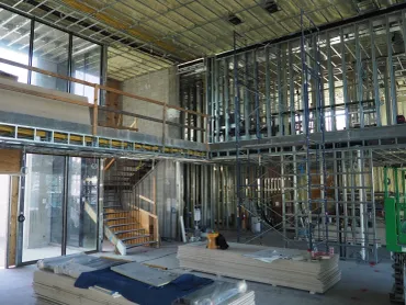 Metal stud framing across two levels of a residence under construction